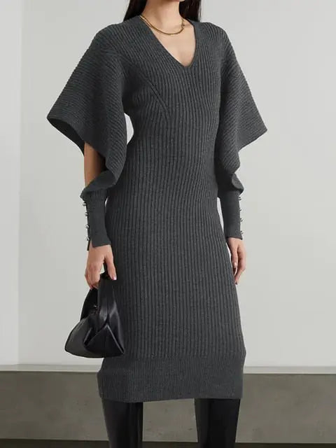 Elegant Knit Dress with Dramatic Shoulder Detail and Flattering Silhouette