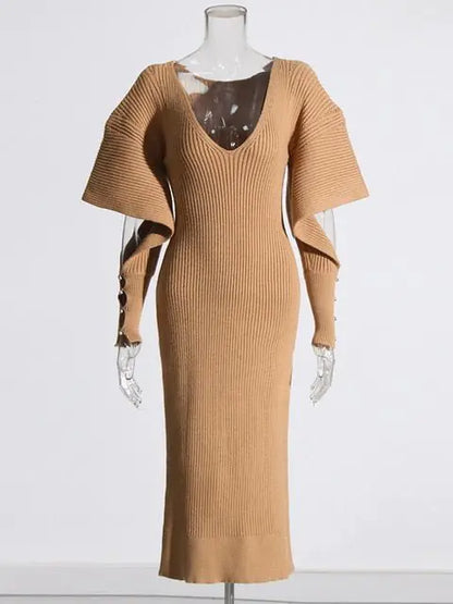 Elegant Knit Dress with Dramatic Shoulder Detail and Flattering Silhouette