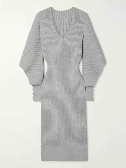 Elegant Knit Dress with Dramatic Shoulder Detail and Flattering Silhouette