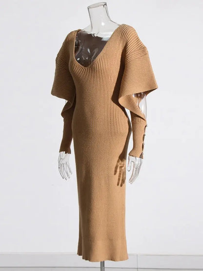 Elegant Knit Dress with Dramatic Shoulder Detail and Flattering Silhouette