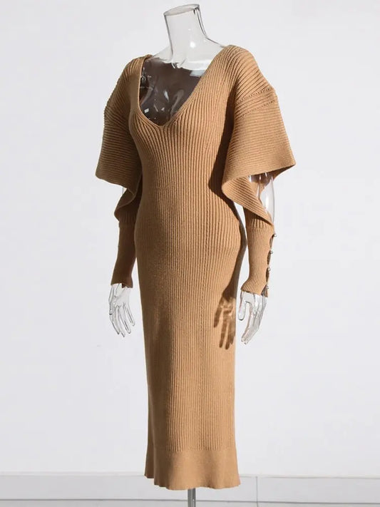 Elegant Knit Dress with Dramatic Shoulder Detail and Flattering Silhouette