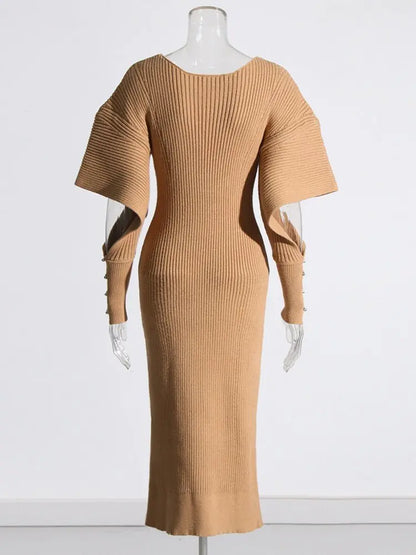 Elegant Knit Dress with Dramatic Shoulder Detail and Flattering Silhouette